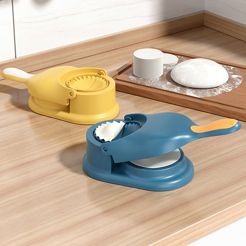 2 in 1 dumpling maker tools in yellow and blue on a kitchen countertop for pastry making and dumpling preparation.