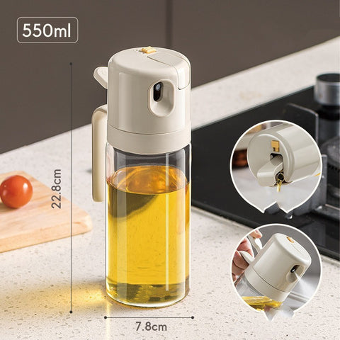 Oil sprayer with a transparent body and a spray nozzle, ideal for dispensing oil in the kitchen.